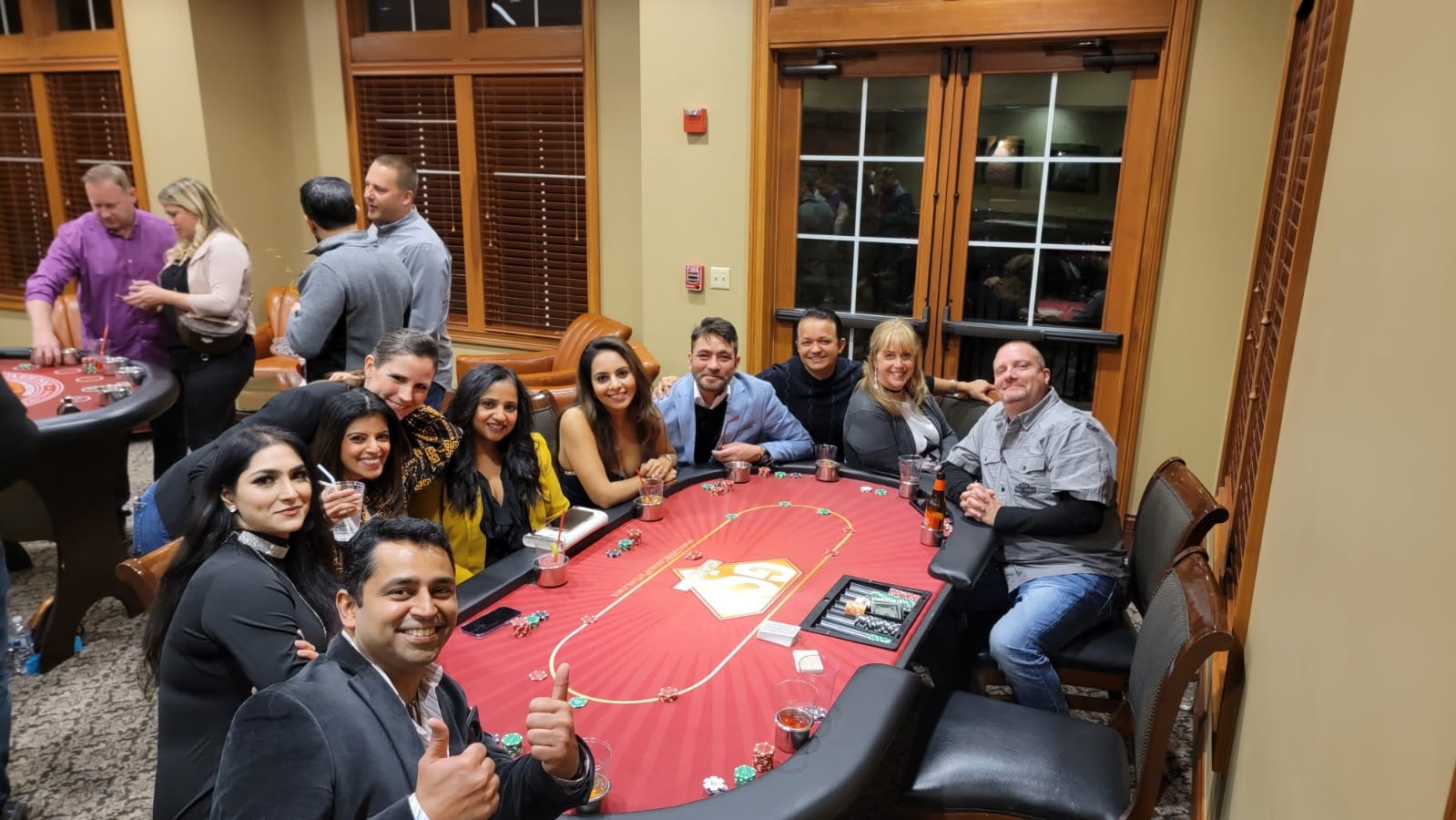 Guests around a roulette table at casino party